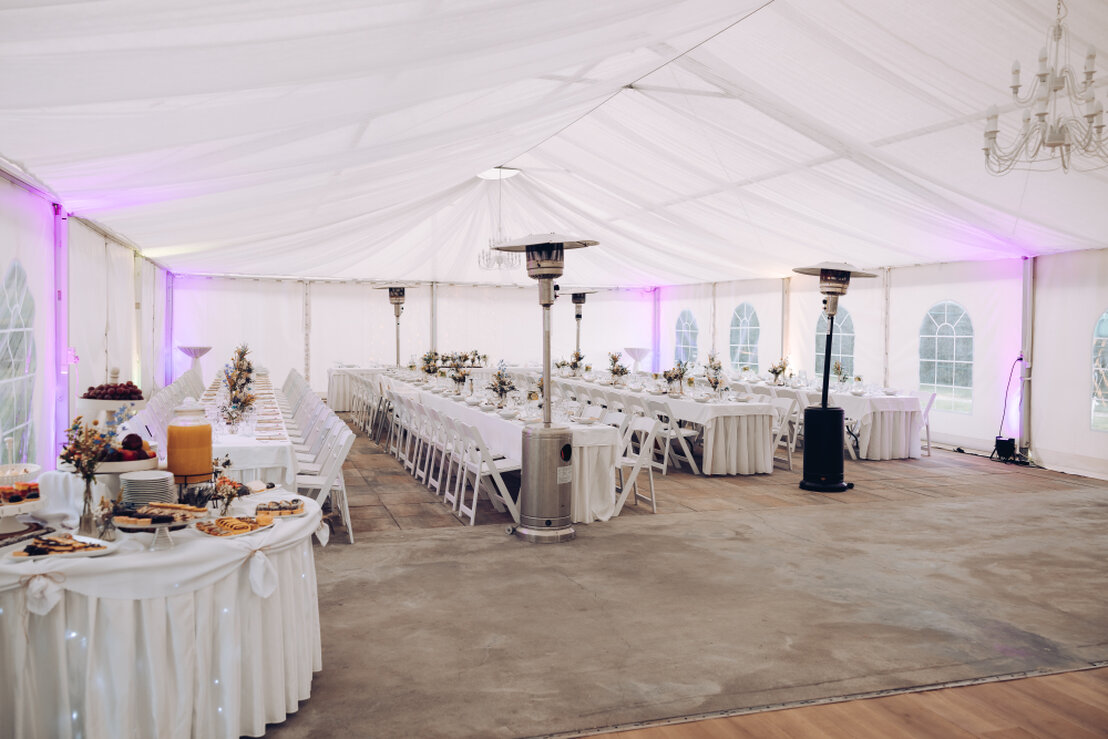 Banquet room set up for a corporate program with stage and podium