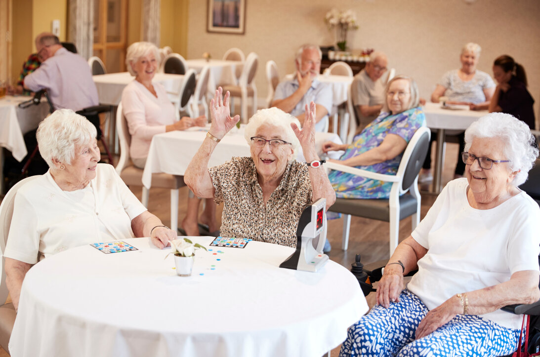 Magician entertaining seniors at a care facility
