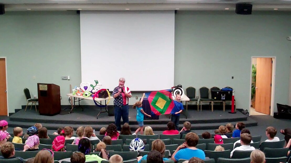 Christian magician sharing an object lesson in a church